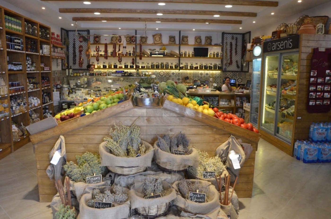 Shelves of Greek cheeses, oils and preserves at Arsenis delicatessen in Naousa
