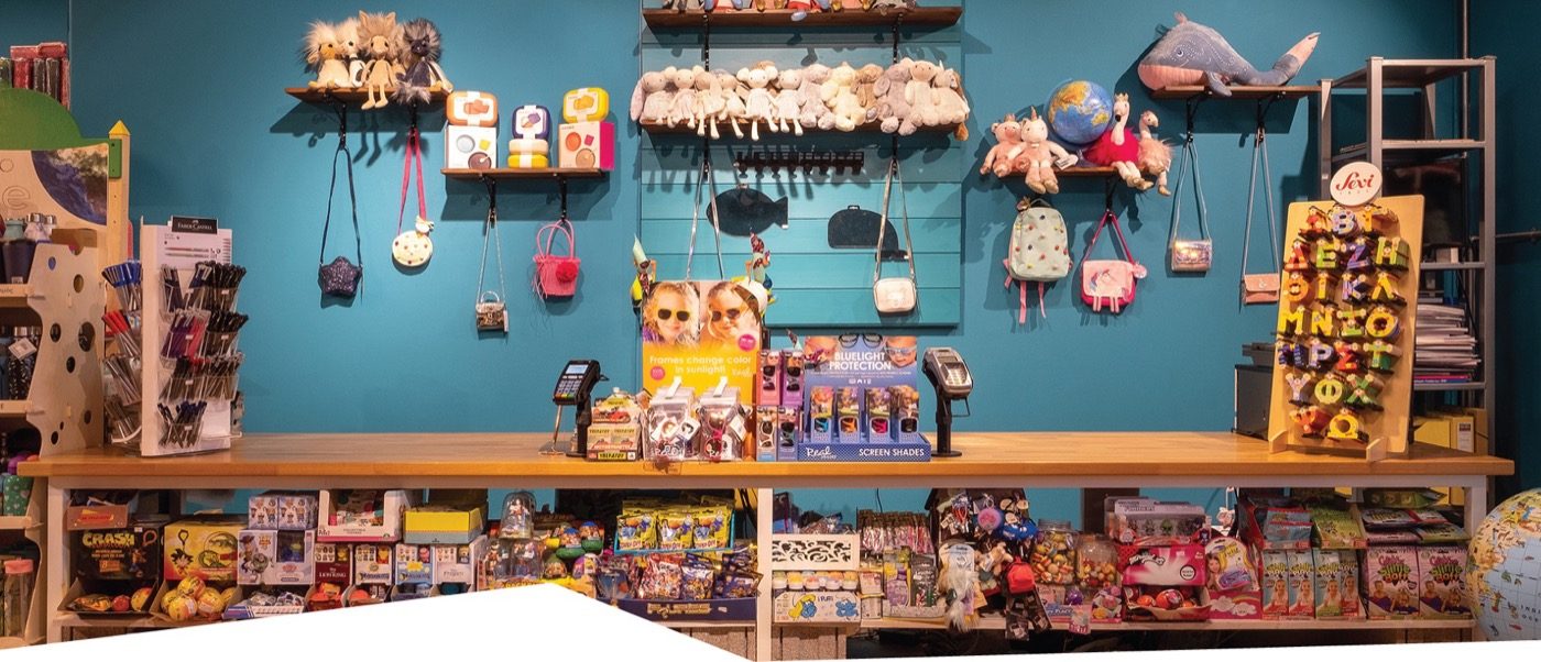 Wooden toys and games displayed at Felix toy shop in Naousa