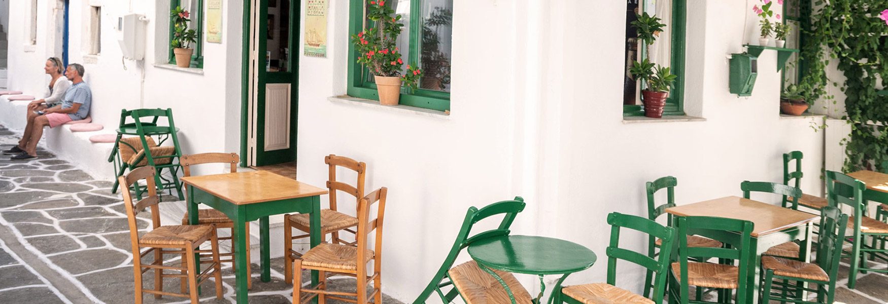 Tables set out on the lane at Vageliss in Naousa