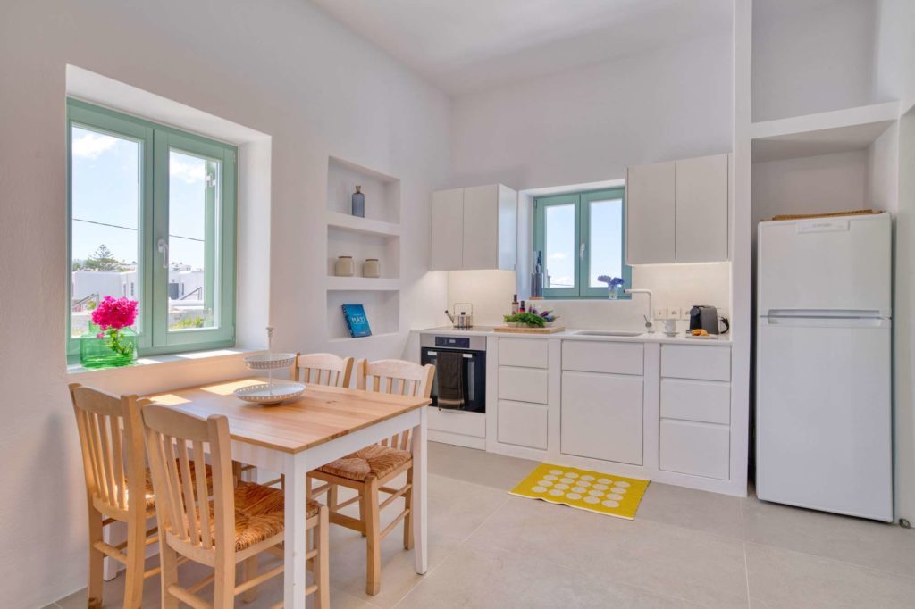 The open-plan living, dining and kitchen space seen from the terrace door