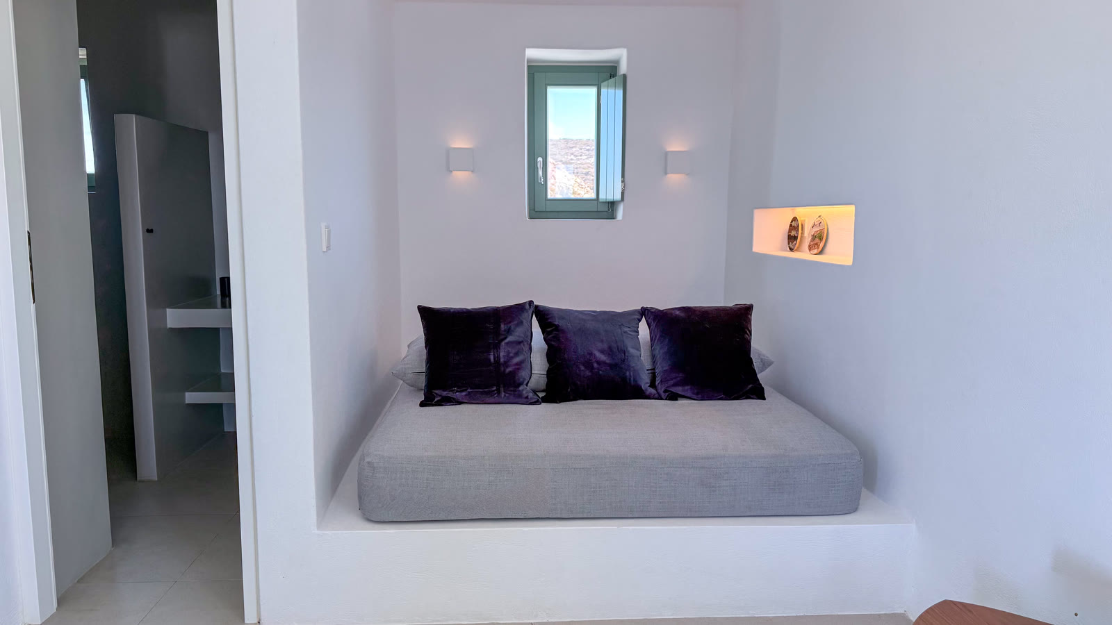 The queen bedroom looking through its private door towards the terrace and sea