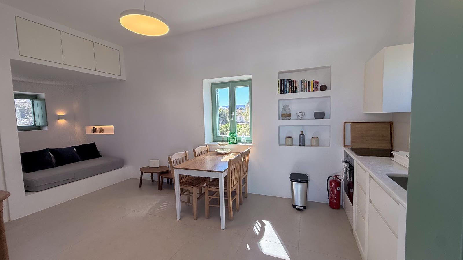 A wide view across the kitchen and dining area towards the terrace windows