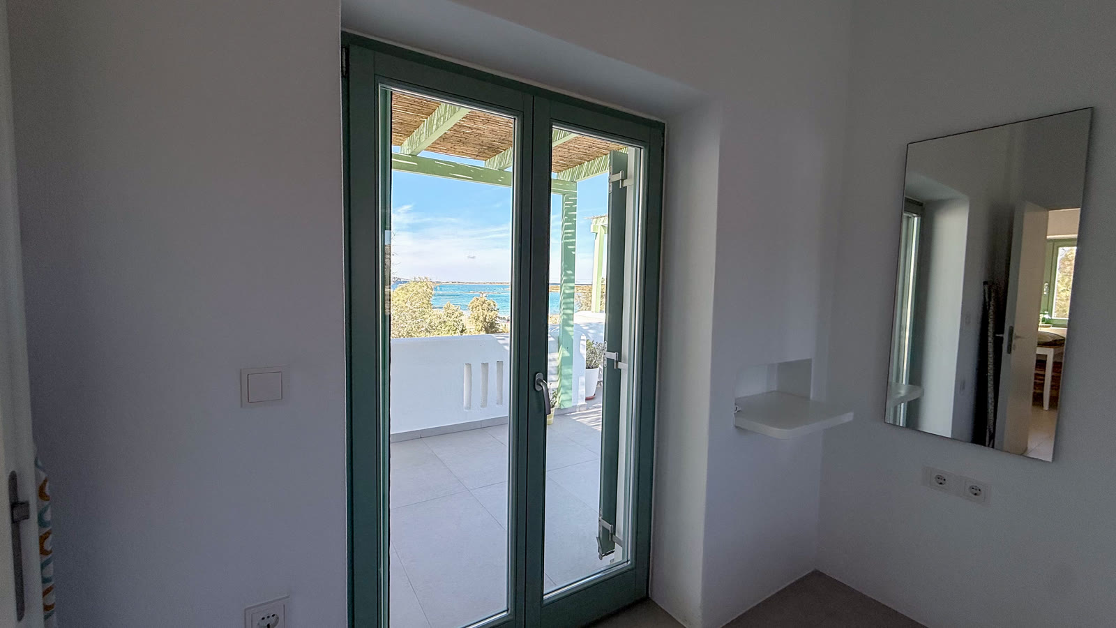 The uninterrupted Aegean Sea view towards the small islands from May Lola